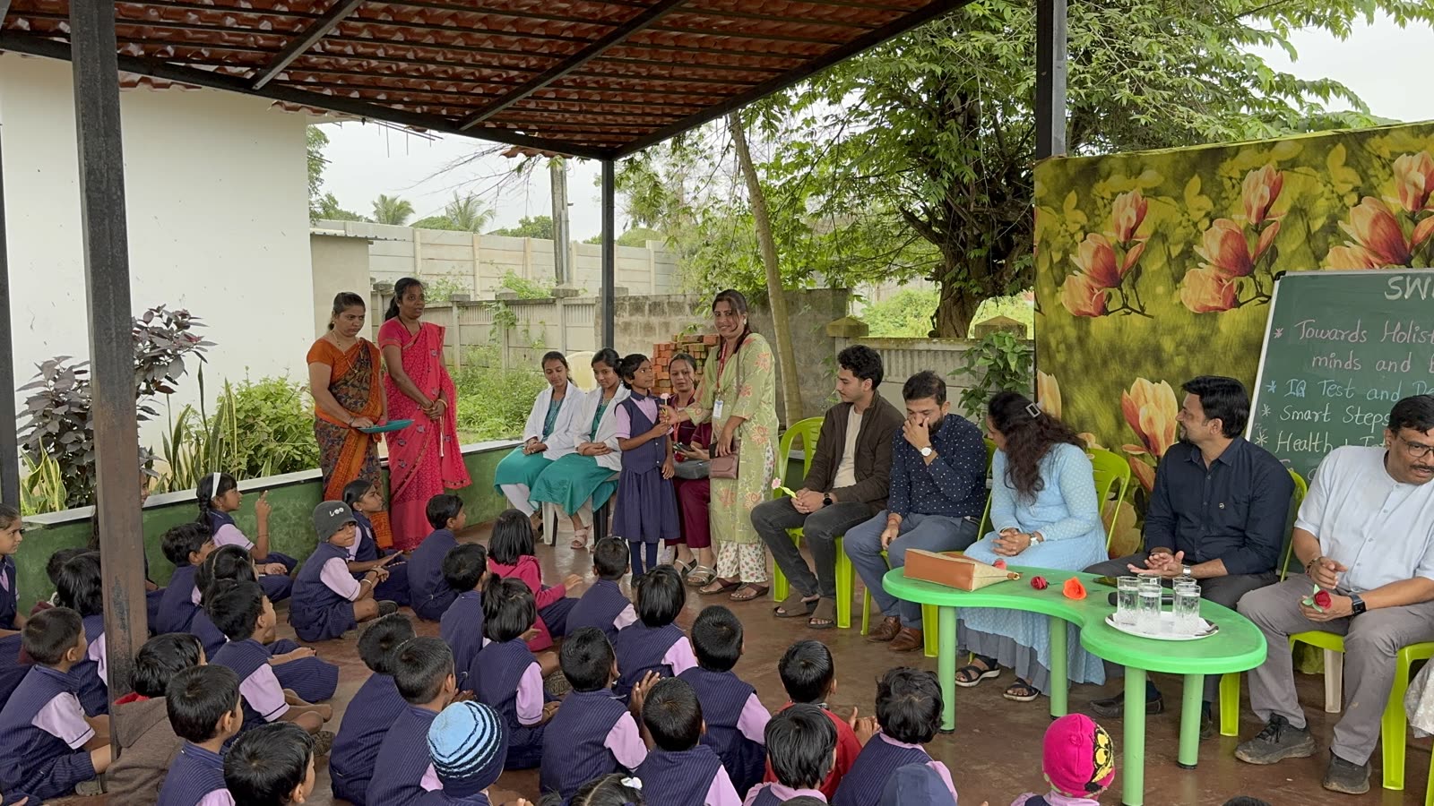 Girl presenting to a panel at an outdoor school assembly